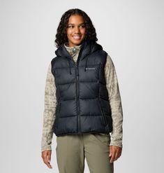 A versatile hooded puffer vest built to take on cold in comfort and style. Hooded Puffer Vest, Vest Puffer, Hiking Jacket, Youth Shoes, Suit Shoes, Hooded Vest, Columbia Jacket, Body Warmer, Sportswear Brand