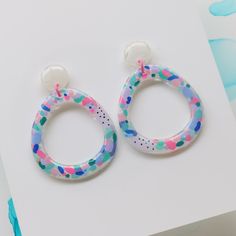 Playful Multicolor Resin Jewelry, Trendy Multicolor Resin Earrings, Multicolor Resin Dangle Jewelry, Multicolor Round Resin Earrings, Artistic Multicolor Resin Earrings