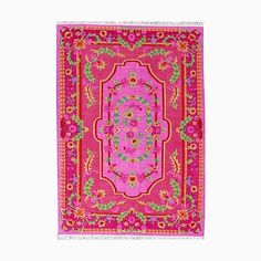 a pink rug with flowers and leaves on the bottom, in front of a white background