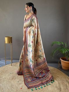 Introducing the epitome of understated elegance and timeless charm - the beige and brown silk saree adorned with exquisite Kalamkari print work and delicately attached tassels on the pallu. With 5.50 meters of sheer sophistication, this saree is poised to become the centerpiece of your wardrobe, adding a touch of breezy vibrancy to your upcoming festivals, occasions, and other special functions.
The fusion of beige and brown hues creates a harmonious palette that exudes warmth and sophistication Semi-stitched Beige Saree For Eid, Bollywood Style Beige Silk Traditional Wear, Traditional Beige Saree, Beige Silk Traditional Wear With Traditional Drape, Unstitched Beige Bollywood Saree, Diwali Beige Traditional Drape Blouse Piece, Festive Beige Jamawar Traditional Wear, Festive Bohemian Cream Traditional Wear, Traditional Beige Silk Saree