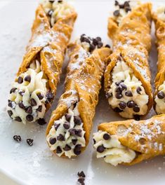 chocolate chip crepes with cream and chocolate chips on top are ready to be eaten