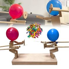 three balls are being balanced on top of each other in front of a balancer