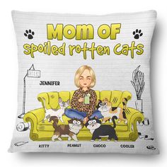 a woman sitting on top of a yellow couch with cats around her and the words mom of spoiled rotten cats