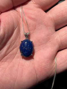 ## Exquisite Handmade Lapis Lazuli Pendant Elevate your jewelry collection with our stunning **Handmade Lapis Lazuli Pendant a true testament to nature's artistry. This exquisite piece features a **natural and untreated lapis lazuli stone renowned for its deep, celestial blue hue and captivating gold flecks of pyrite. Measuring **18mm x 13mm the stone is perfectly sized to make a statement while remaining comfortably wearable. Necklace is not included. The listing is only for the pendant in disp Lapis Lazuli Necklace Handmade, Celestial Blue, Lapis Lazuli Jewelry, Lapis Lazuli Pendant, Lapis Lazuli Necklace, Gold Flecks, Lapis Lazuli Stone, Unique Features, Intricate Patterns