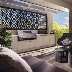 a living room with furniture and an outdoor grill