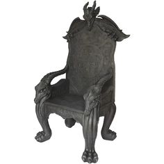 a carved chair with an animal head on the back and arms, sitting in front of a white background