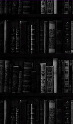 black and white photograph of books on shelves in a room with purple trim around the edges