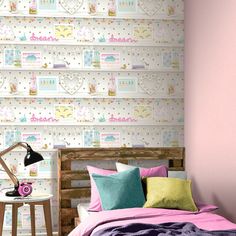 a bed room with a neatly made bed and wallpaper on the walls behind it