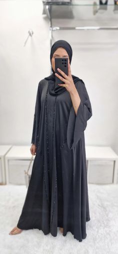 Crafted from premium korean nidha, the ‘khadija’ Double nidha Abaya offers both luxurious style and functionality. The long, non-slippery hijab ensures a comfortable fit, while the exquisite handwork adds an exclusive touch. With its non-see through design, this abaya is perfect for any occasion. Long Niqab With Dabka For Eid, Long Dabka Niqab For Eid, Free Size Long Abaya For Eid, Long Khimar With Dabka Detailing, Traditional Niqab With Dabka For Eid, Traditional Dabka Niqab For Eid, Modest Dabka Abaya For Eid, Modesty Panel Hijab For Eid, Abaya Black