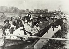 an old black and white photo of people on a boat