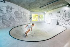 a man riding a skateboard up the side of a ramp at a skate park