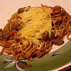 the plate has spaghetti and meat on it