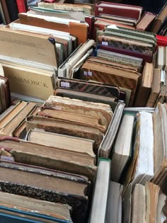 many books are stacked on top of each other