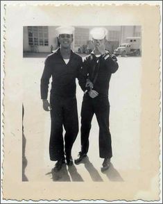 two men in sailor's uniforms are standing next to each other