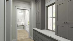 an empty hallway with gray cabinets and white walls