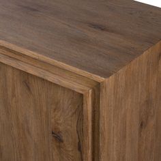 a close up of a wooden cabinet with wood grain on the top and bottom part