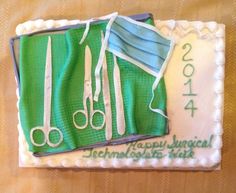 a sheet cake with scissors and surgical masks on it