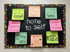 a bulletin board with post it notes attached to it and words written on the back