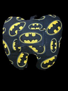 an oven mitt with batman symbols on it