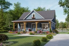 a small blue house with porches and flowers in the front yard