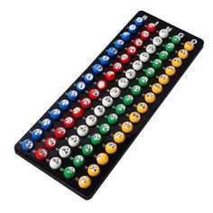 an assortment of pool balls on a black rack