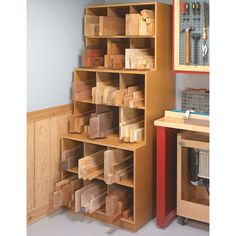 a wooden shelf filled with lots of boxes