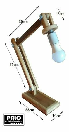 a wooden desk lamp with measurements for the light bulb and wood stand on it's side