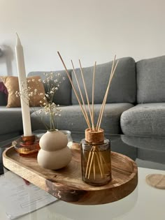 a living room with a couch, table and candles