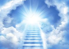 a stairway leading to the sky with bright light coming from behind it and clouds in the foreground