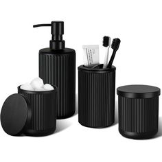 black bathroom accessories set with soap dispenser and toothbrush holder