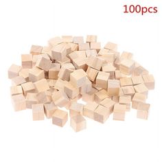 small wooden blocks are stacked on top of each other, with the words 100 pcs