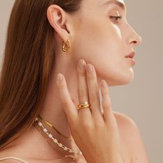 ▼Description Embrace minimalist sensibilities with this golden ring. Made from 18kt gold plated brass, it has a irregular round shape with a freshwater pearl dotted that makes it a stand-out piece. ◄Details Colour: GoldComposition: 18 kt gold brass/pearl ◄Size & Fit Max width: 1.6cmPearl length: 0.5cm ◄Shipping Information Free standard shipping on all orders. An average shipping interval for standard delivery is 5-14 working days. Pearl Stacking Ring, Gold Minimalist Jewelry, Golden Ring, Gold Ring Stack, Waterproof Jewelry, Jewelry Manufacturers, Gold Brass, Jewelry Inspo, Pearl Size