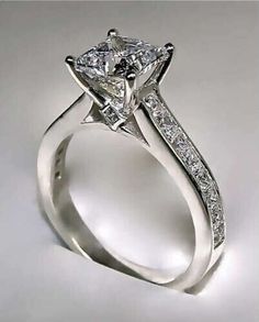 a princess cut diamond engagement ring with side stones