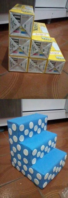 blue and white chair sitting on top of a wooden floor next to stacks of boxes