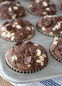 chocolate cupcakes with almonds in a muffin tin