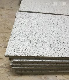 some white and black speckles are stacked on top of each other in a room