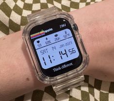 a close up of a person's wrist with a watch on the display screen