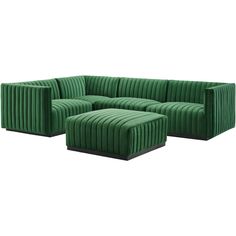 a green couch and ottoman sitting next to each other