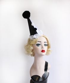 Black and White Clown Hat, Cirque Costume, Birthday Party Hat, Kids, Adults, Carnival, Burlesque Headpiece, Circus Hair Accessory This mini clown hat is made from black and white satin that has been put on half and half, over a buckram frame that has been also covered in felt- so it's super sturdy and has a perfectly smooth surface. It has gorgeous trim of ruffled white satin with two pom poms up the front and a huge handmade pom pom at the top. It comes on a headband that goes through elastic o Circus Hair, Black And White Clown, Clown Hat, Birthday Party Hats, Kids Costumes, Party Hats, Etsy Australia, Headpiece, Pom Pom