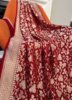 This beautiful Maroon Color Pure Khaddi Georgette Banarasi Saree is a must have for any special occasion! Crafted with love, this saree features a luxurious fabric that is sure to make you stand out.   🌸fabric- pure Khaddi Georgette  🌸color-maroon 🌸pico and fall- yes , saree is ready with fall  and pico. 🌸blouse, yes blouse piece comes with saree 🌸wash method- dry cleaning only  🌸work- saree hai all over golden zari jaal work. 🌸Saree comes with unstitched blouse piece  Ready to wear saree Red Dupatta With Resham Embroidery For Celebration, Red Dupatta In Traditional Drape For Celebration, Red Dupatta For Celebration With Traditional Drape, Red Dupatta For Celebration In Traditional Drape, Red Traditional Wear With Sheer Dupatta, Traditional Red Wear With Sheer Dupatta, Traditional Red Dupatta For Celebration, Red Dupatta With Zari Work For Celebration, Elegant Red Dupatta With Cutdana