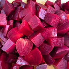 sliced beets on a cutting board ready to be cooked