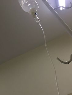 a light that is hanging from the ceiling in a room with no one around it