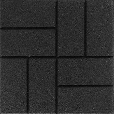 a black brick wall that is made out of different types of bricks and has white lines on it