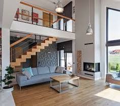 a living room filled with furniture and a fire place