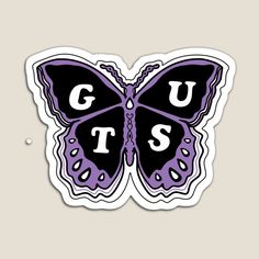 a purple and black butterfly with the word guts on it