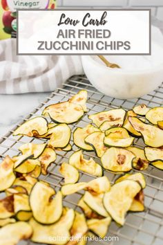 zucchini chips on a cooling rack with the words low carb air fried zucchini chips