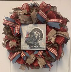 This lovely wreath is made of poly burlap mesh and jute poly mesh, which are waterproof, thicker, and have a more substantial hold and body than other types of mesh. This very thick and FULL wreath is crafted on a 15-inch wired, elevated, work wreath form. The meshes are a 21" Chocolate/Natural Jute Poly Mesh and an awesome, quality, 10" Red Poly Burlap Mesh. The 10" Poly Burlap Mesh compliments the 21" Jute Poly Mesh, giving the wreath a great fall feel! There are 4 different ribbons containing tones of brown, beige, white, red and blue that come together to compliment the mesh. The 2.5" and 1.5" ribbons are incorporated into the wreath through ribbon tails. Rounding out the wreath is an awesome 9" x 9" sign that says, "Turkey." The sign is a replica of a portrait by Darren Gygi, a profes Darren Gygi, Turkey Wreath, Work Wreath Forms, Thanksgiving Wreath, Work Wreath, Festive Wreath, Wreath Farmhouse, Thanksgiving Wreaths, Wreath Fall