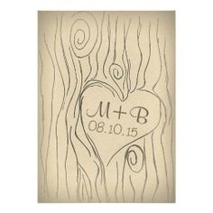 a wedding card with a heart in the middle and initials on it's side