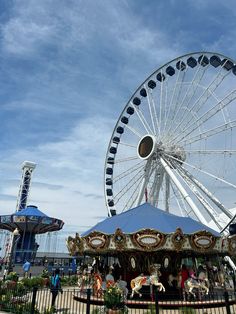 an amusement park with a ferris wheel and rides