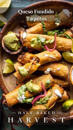 a plate filled with taquitass and guacamole on top of it